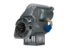 A new 12V Kubota starter motor with a 1.4 kW power rating, showing a metallic body with electrical connectors and a label.