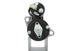 back view of A new 12V aftermarket starter motor 1.1KW with 9 teeth designed for a Perkins engine, featuring a silver body with mounting brackets and electrical connectors.