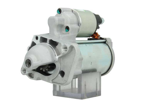 A new 12V starter Renault 1.7 kw, with visible metal and electrical components and 9 teeth, against a white background.