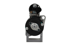 back view of A new 12V starter motor 2.2KW for Volkswagen and MAN vehicles, displaying the exterior metal housing and electrical connectors. 