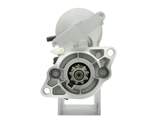 front view of A new 12V Kubota starter motor with a silver and gray color, 1.2KW and 9 teeth featuring various electrical connectors and mounting points.