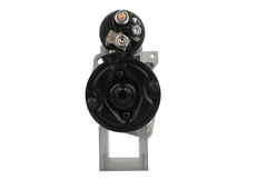 back view of A new 12V starter motor 2.2KW with 10 teeth built for Mercedes vehicles, showcasing the metal body with electrical connectors and the drive gear.