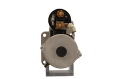 back view of A gray 24V starter motor for a daf trucks, 4.3KW, with visible mounting points and electrical connectors.