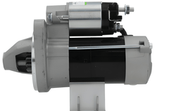 side view of A new 12V 9 teeth 1.1KW starter motor for vehicles, predominantly metal with a gray finish, including mounting brackets and electrical terminals.